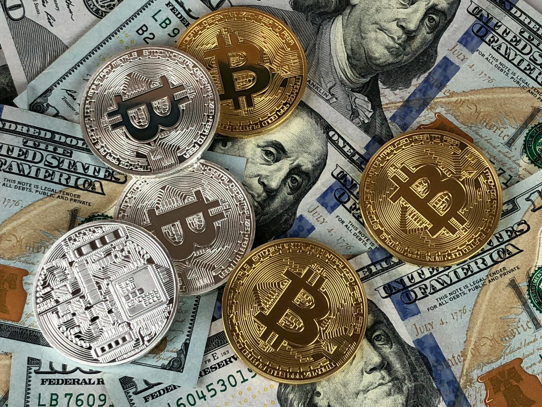 Bitcoin cryptocurrency next to US dollar bills - crypto casino deposits