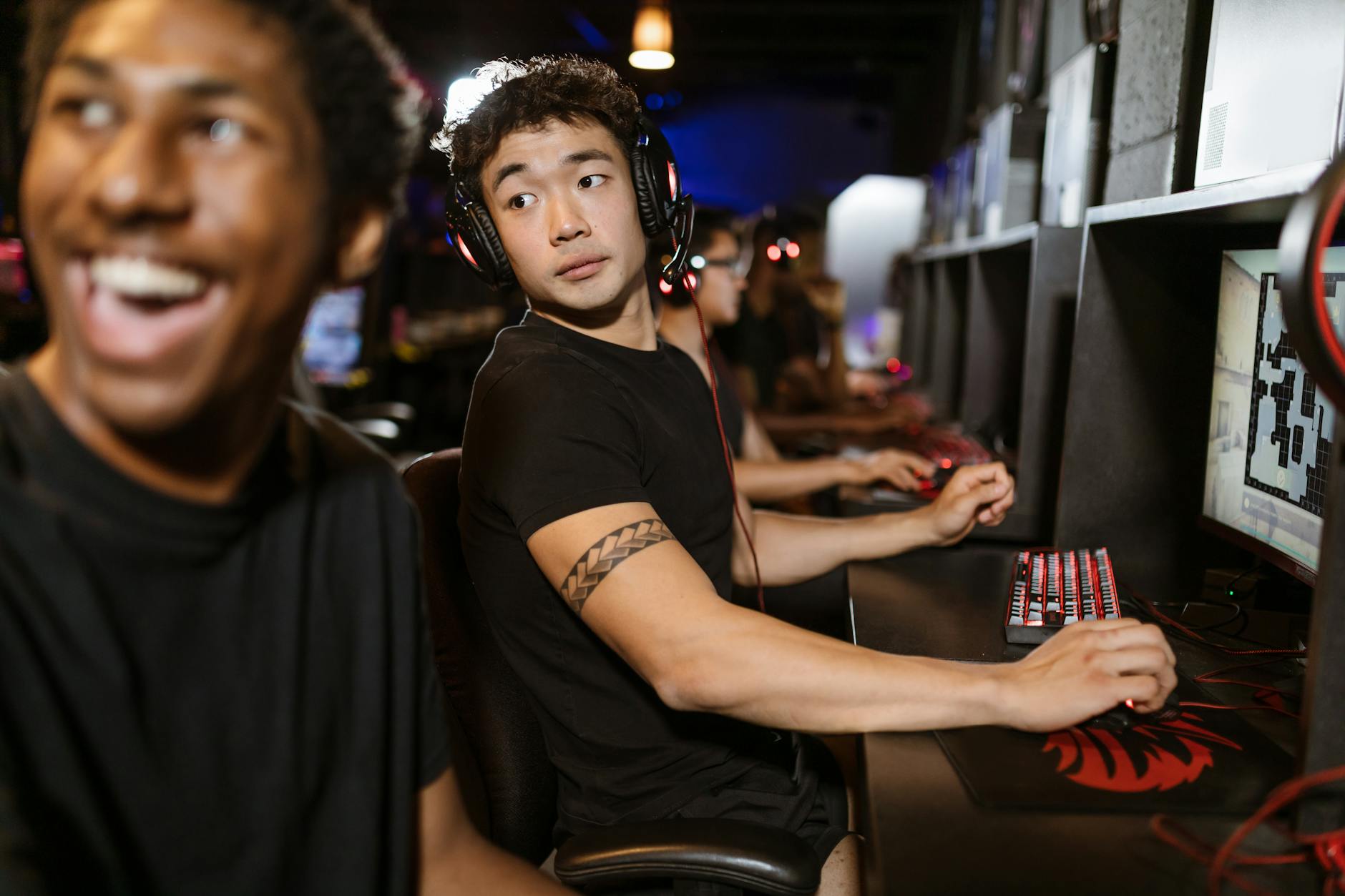 Gamers competing in an esports arena with professional gaming setups