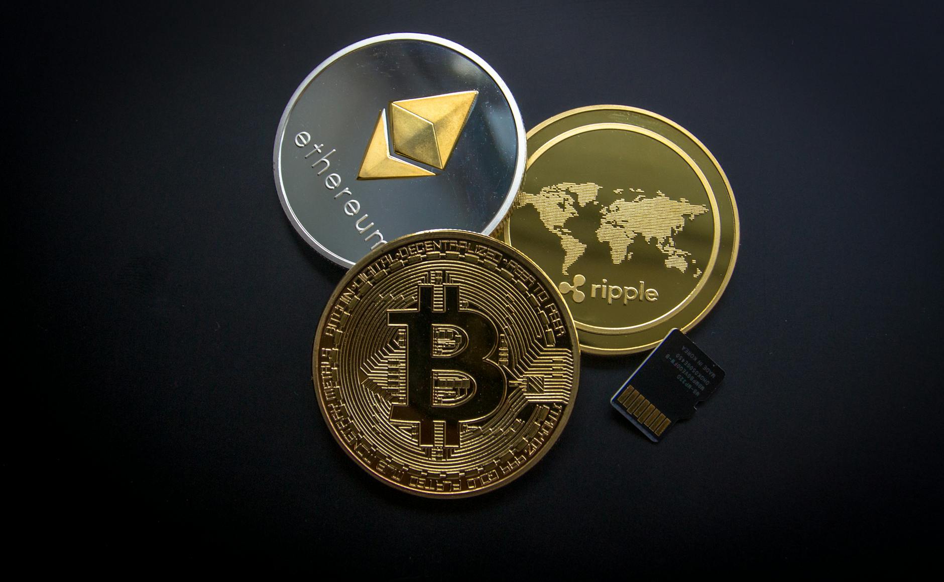 Bitcoin, Ethereum and Ripple cryptocurrency coins for crypto casino gambling