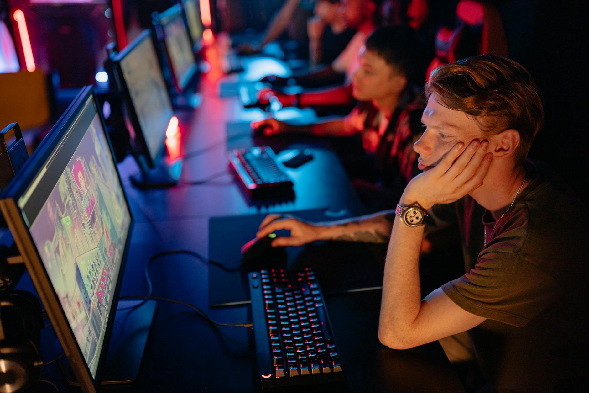 Professional esports players focused during a competitive gaming tournament
